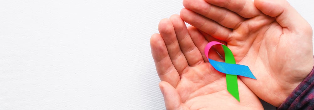 Hands holding rare disease month awareness ribbon